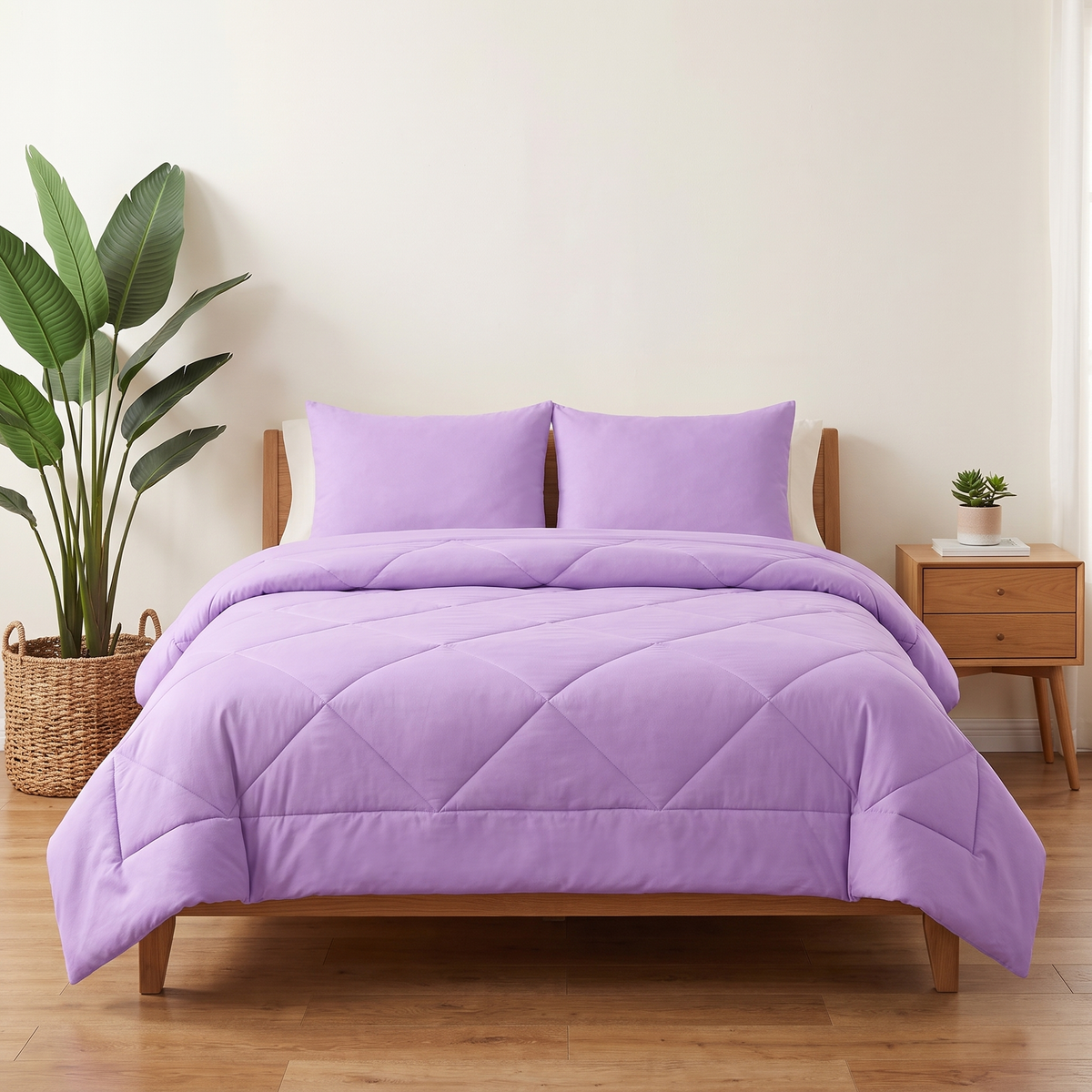 The 2-in-1 Comforter in Twilight Purple on a made bed
