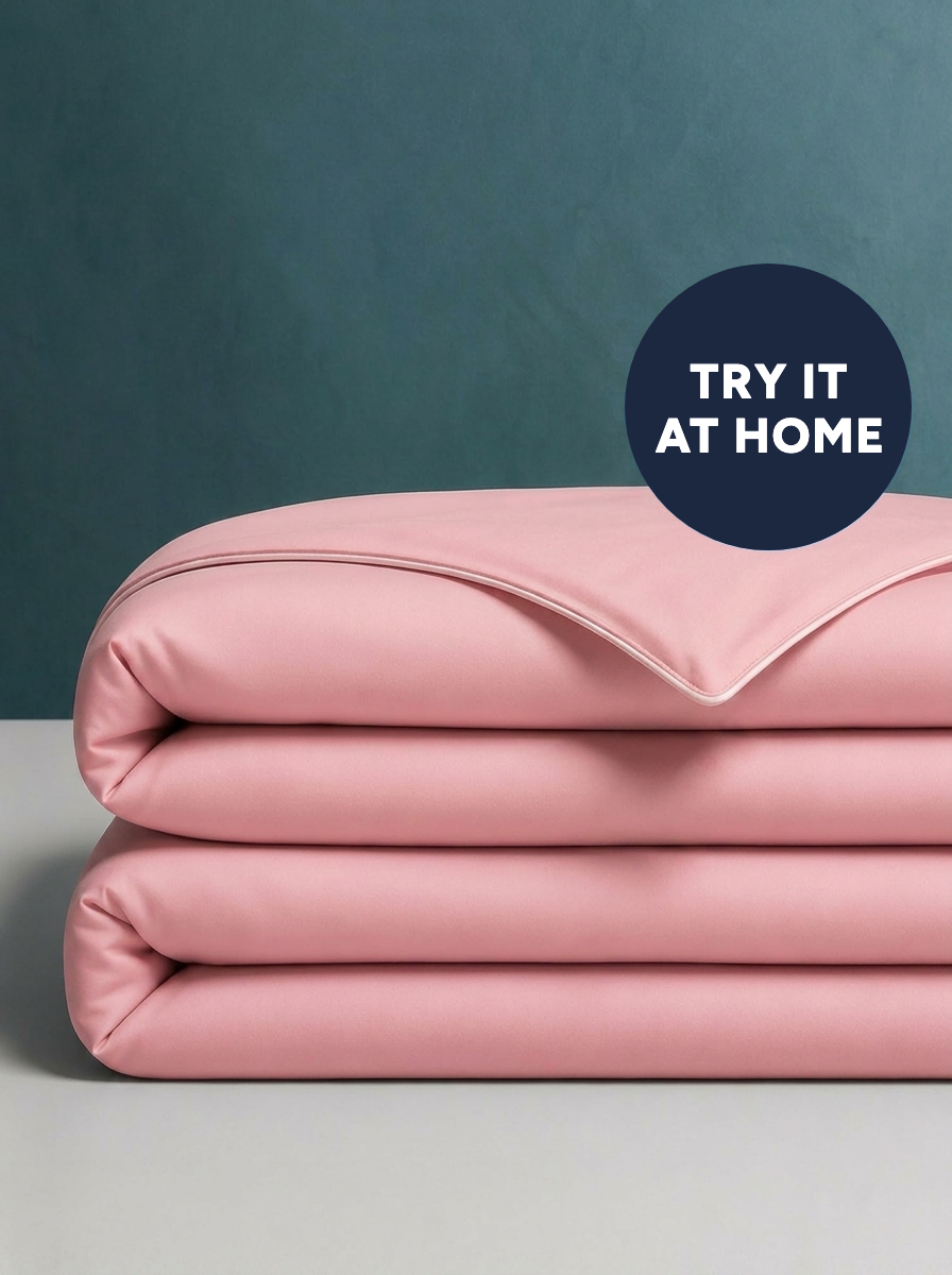 The Cooling Comforter in Frost Pink, folded · Try it at home