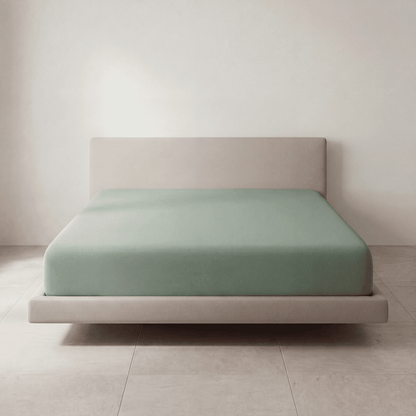 The Fitted Sheet in Soft Mint on a mattress