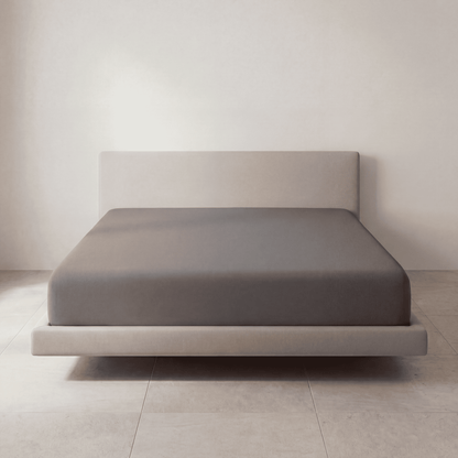 The Fitted Sheet in Moonstone Gray on a mattress